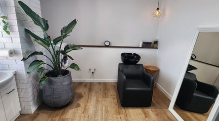 Modern salon wash station at Looks By Brooke Clinic, Melbourne, Victoria, AU. Elegant design with plant decor.