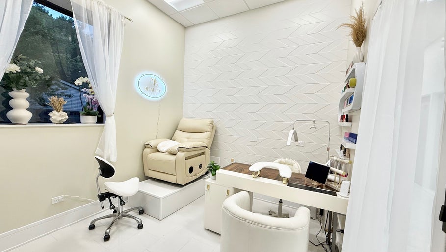 Cozy interior of M Beauty Nails in Chicago, Illinois, US, featuring a plush manicure station and tranquil decor.