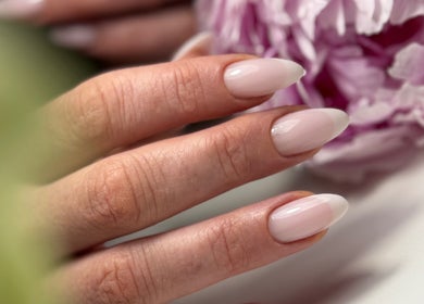 Elegant manicured nails with soft pink polish at M Beauty Nails in Chicago, Illinois, US.