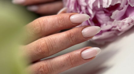 Elegant manicured nails with soft pink polish at M Beauty Nails in Chicago, Illinois, US.