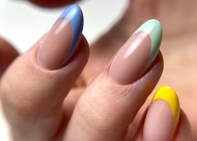 Vibrant multicolored nails at M Beauty Nails, Chicago, Illinois, US, showcasing expert manicure artistry.