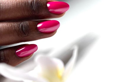 Close-up of manicured pink nails at M Beauty Nails, Chicago, Illinois, US, showing vibrant nail art.