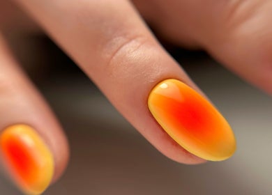 Bright orange and yellow gradient nails at M Beauty Nails, Chicago, Illinois, US.