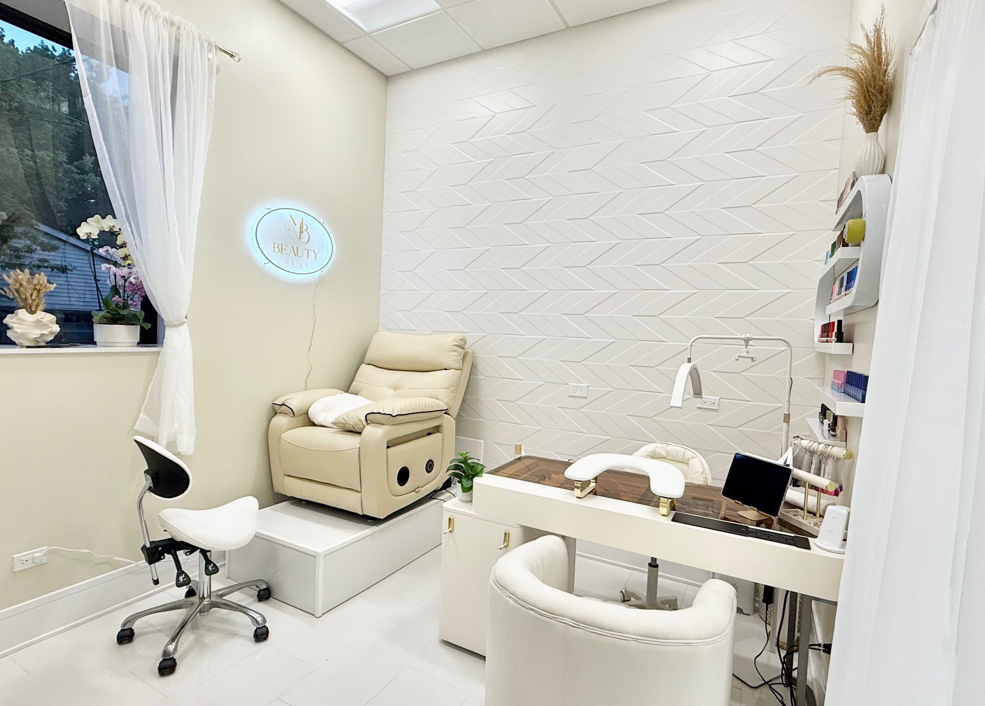 Tranquil interior of M Beauty Nails, a spa-like nail salon in Chicago, Illinois, US with plush seating.