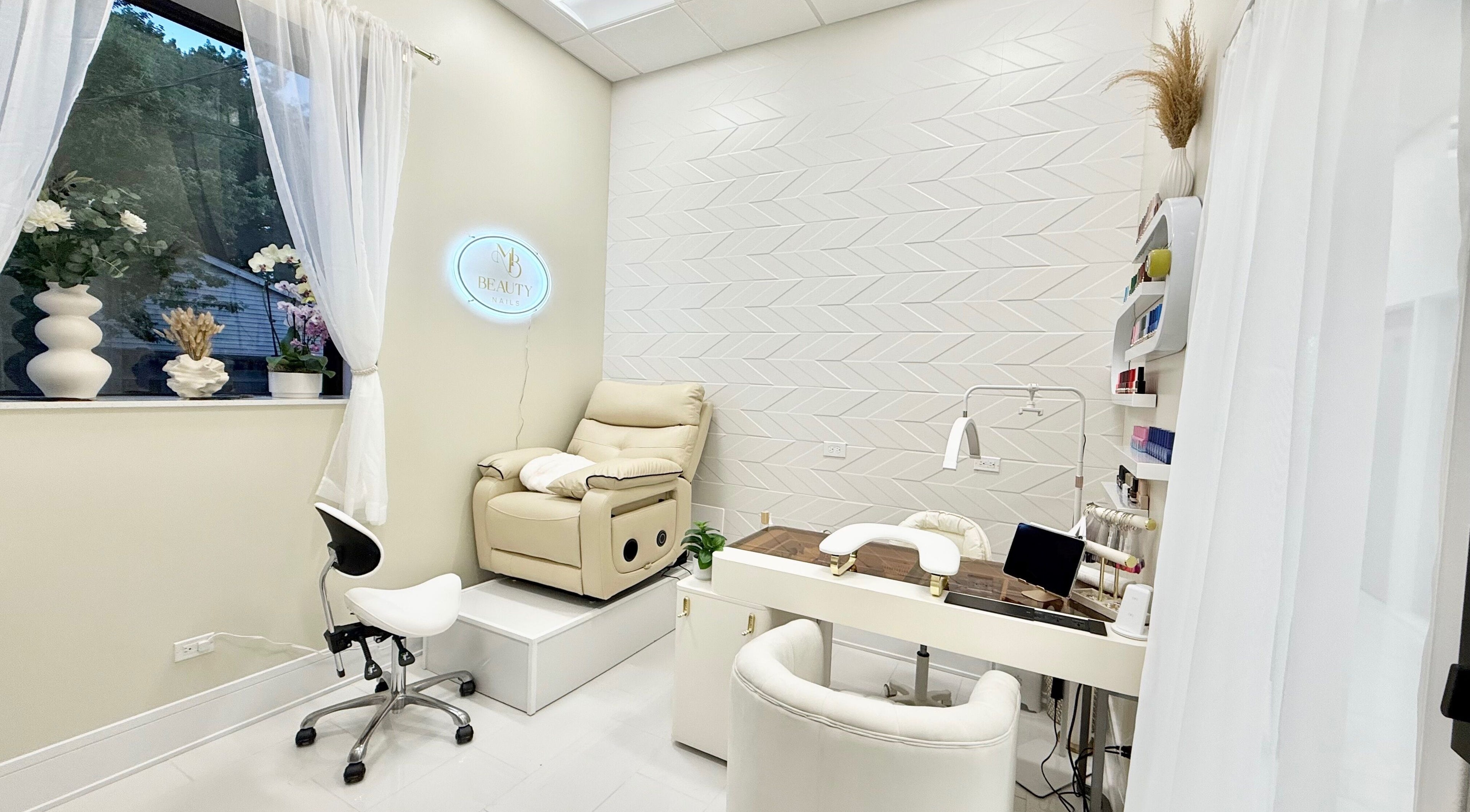Tranquil interior of M Beauty Nails, a spa-like nail salon in Chicago, Illinois, US with plush seating.