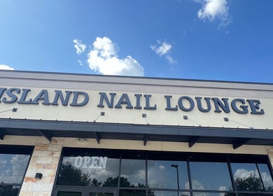 Exterior view of Island Nail Lounge in Houston, Texas, US under a sunny sky.