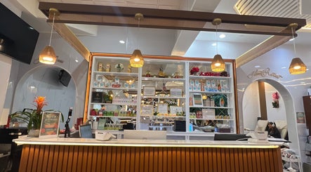 Reception at Island Nail Lounge in Houston, Texas, US with glowing lights and neatly arranged products on shelves.