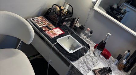 Makeup station at LR Beauty in Stalybridge, England, GB with palettes, brushes, and mirror.