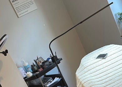 Cozy treatment room at LR Beauty, Stalybridge, England, GB with a well-prepared massage bed and essential beauty tools.