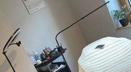 Cozy treatment room at LR Beauty, Stalybridge, England, GB with a well-prepared massage bed and essential beauty tools.