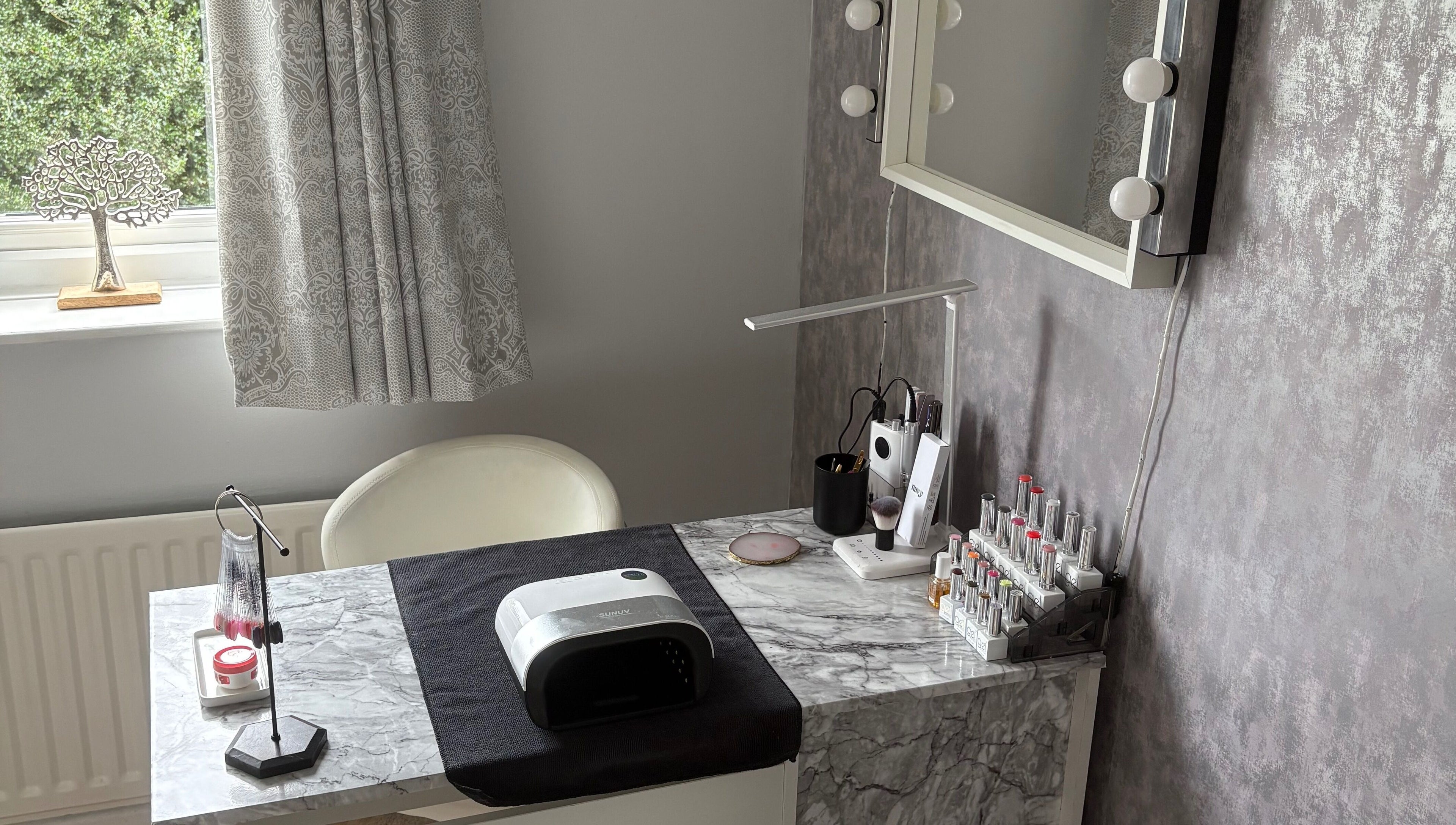 Chic beauty station at LR Beauty, Mossley, England, GB with elegant decor and nail polish display.