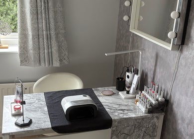 Modern nail station at LR Beauty, Mossley, England, GB showcasing elegant decor and nail care tools.