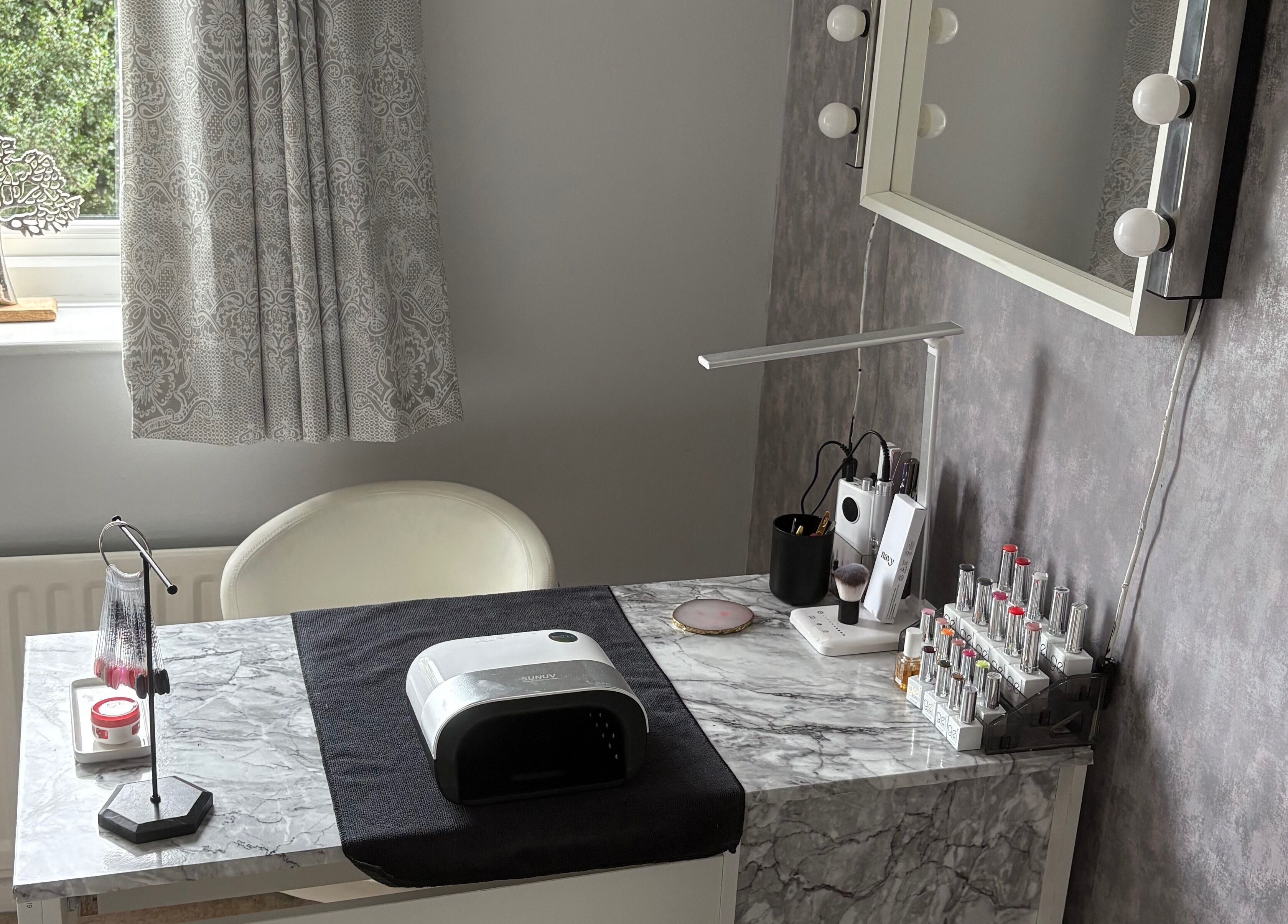Modern nail station at LR Beauty, Mossley, England, GB showcasing elegant decor and nail care tools.