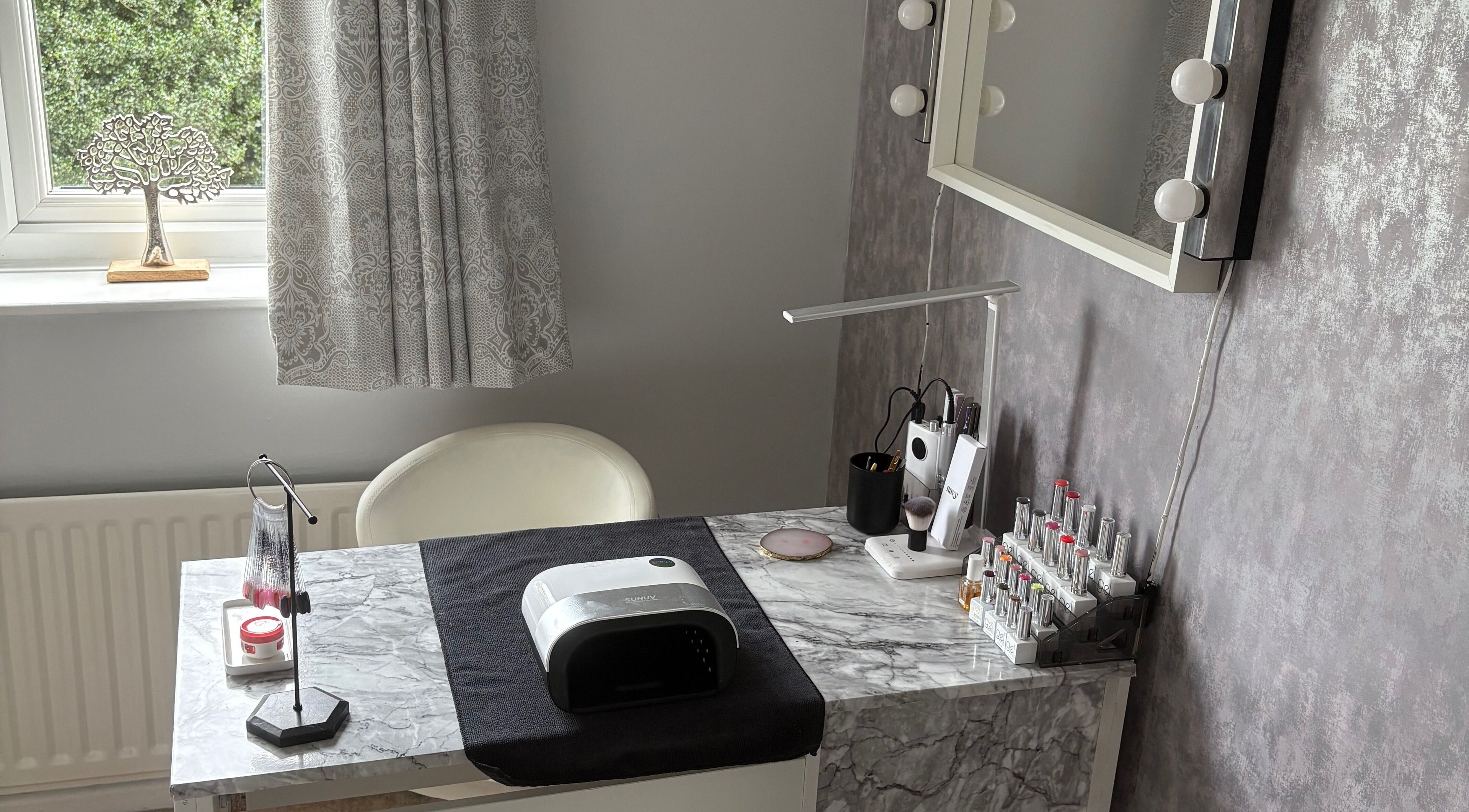 Modern nail station at LR Beauty, Mossley, England, GB showcasing elegant decor and nail care tools.