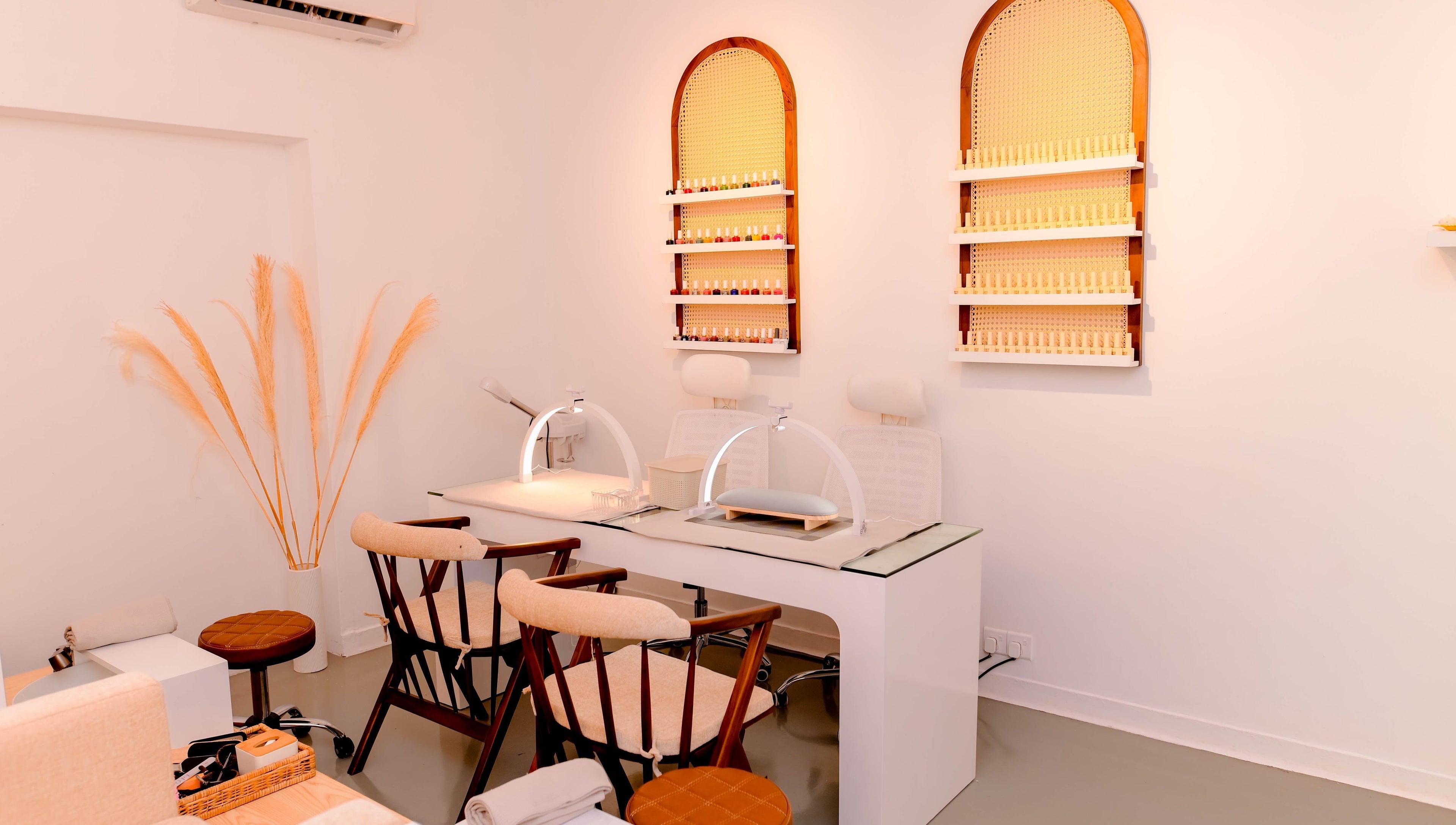 Elegant nail care station at Lilly's, Colombo, Western Province, LK, featuring minimalist design and polish display.