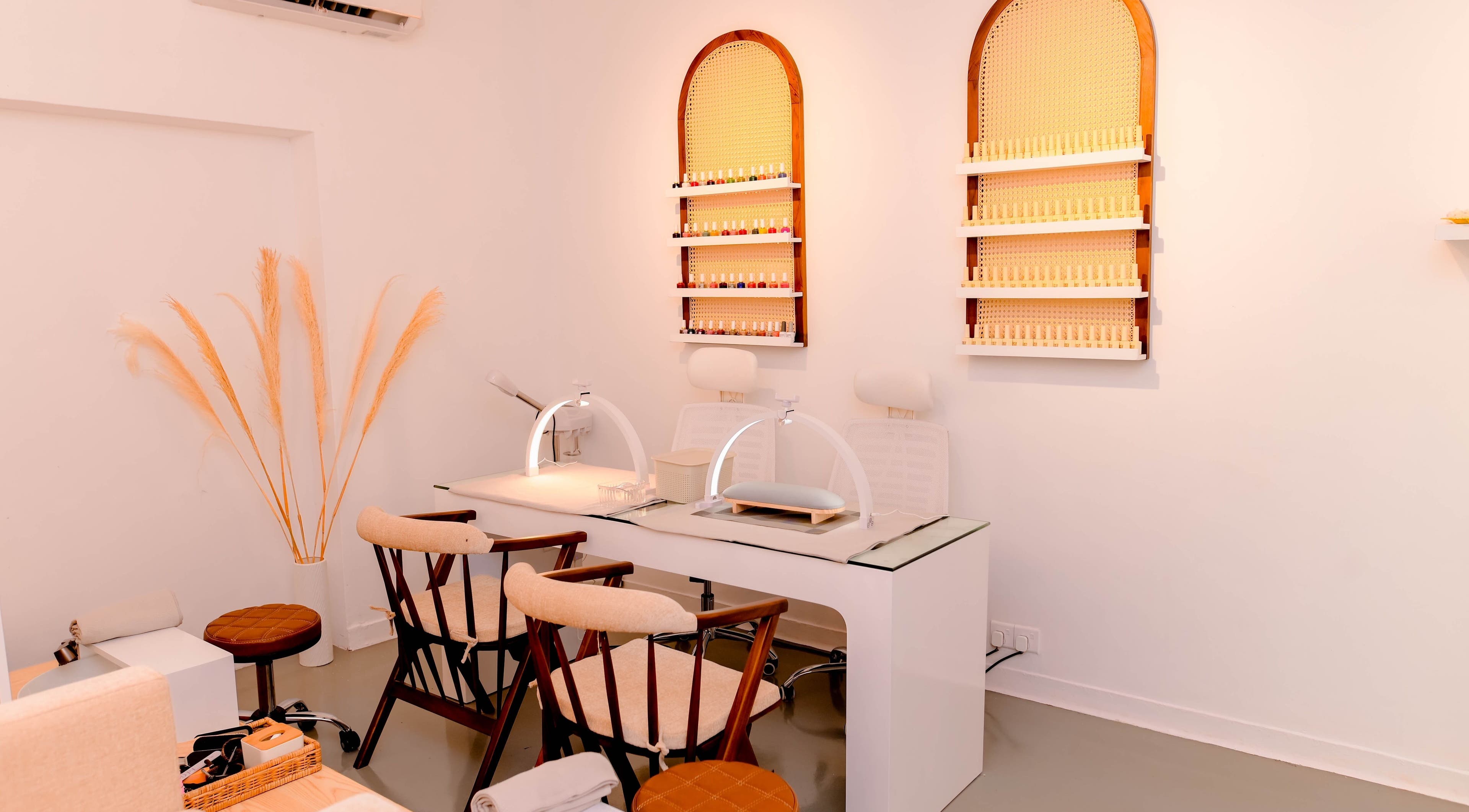 Elegant nail care station at Lilly's, Colombo, Western Province, LK, featuring minimalist design and polish display.