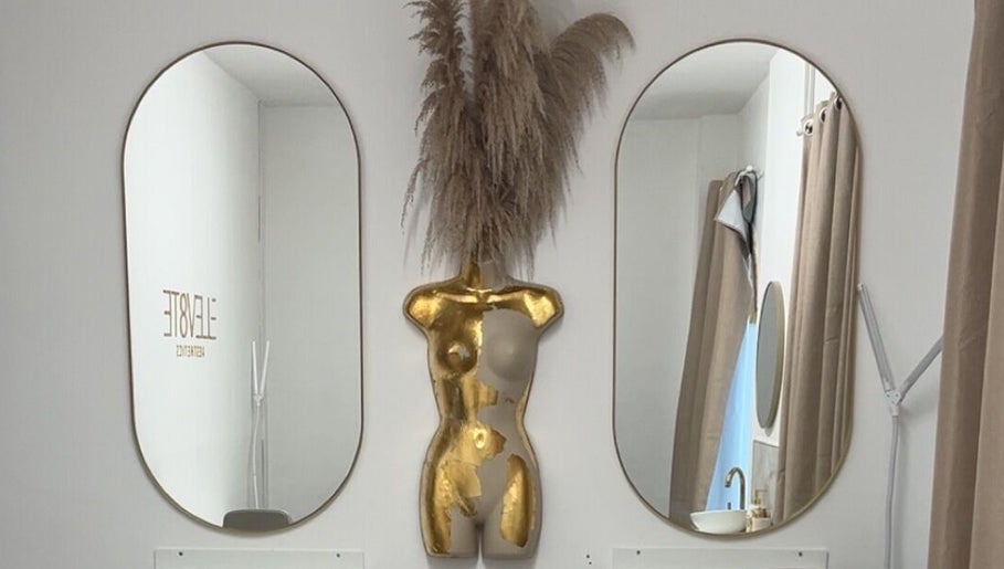 NV Aesthetics decor in Syston, England, GB featuring mirrors and a gold torso sculpture.