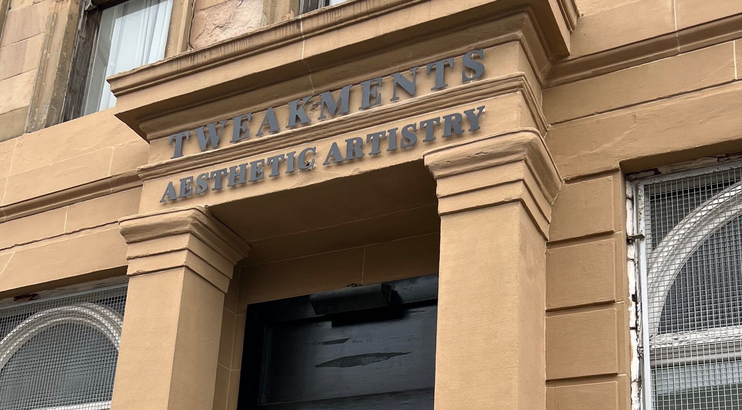 HM Advanced Aesthetics entrance in Glasgow, Scotland, showcasing elegant stone facade.
