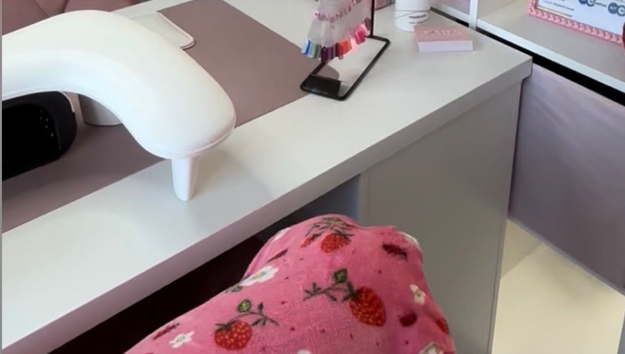 Nail station with vibrant colors and decor at Nails by Grace, Gosport, England, GB.
