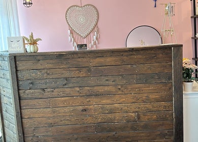 Welcoming reception at Admire Beauty and Nail Studio, Vernon, British Columbia, CA with rustic wood decor.