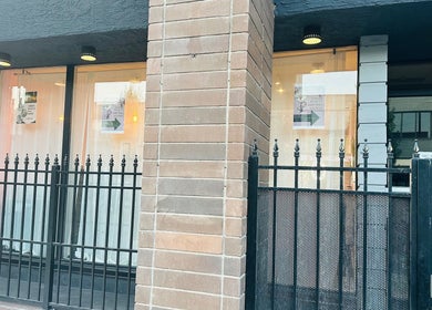 Entrance of Admire Beauty and Nail Studio in Vernon, British Columbia, CA, featuring a modern glass and brick design.