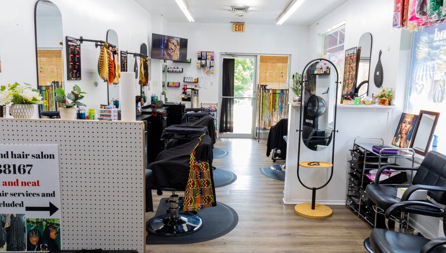 Interior of BraidingLand Hair Salon in Gaithersburg, Maryland, US, showcasing stylish chairs and decor.
