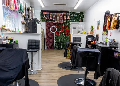 BraidingLand Hair Salon in Gaithersburg, Maryland with stylish chairs, mirrors, and hair supplies.