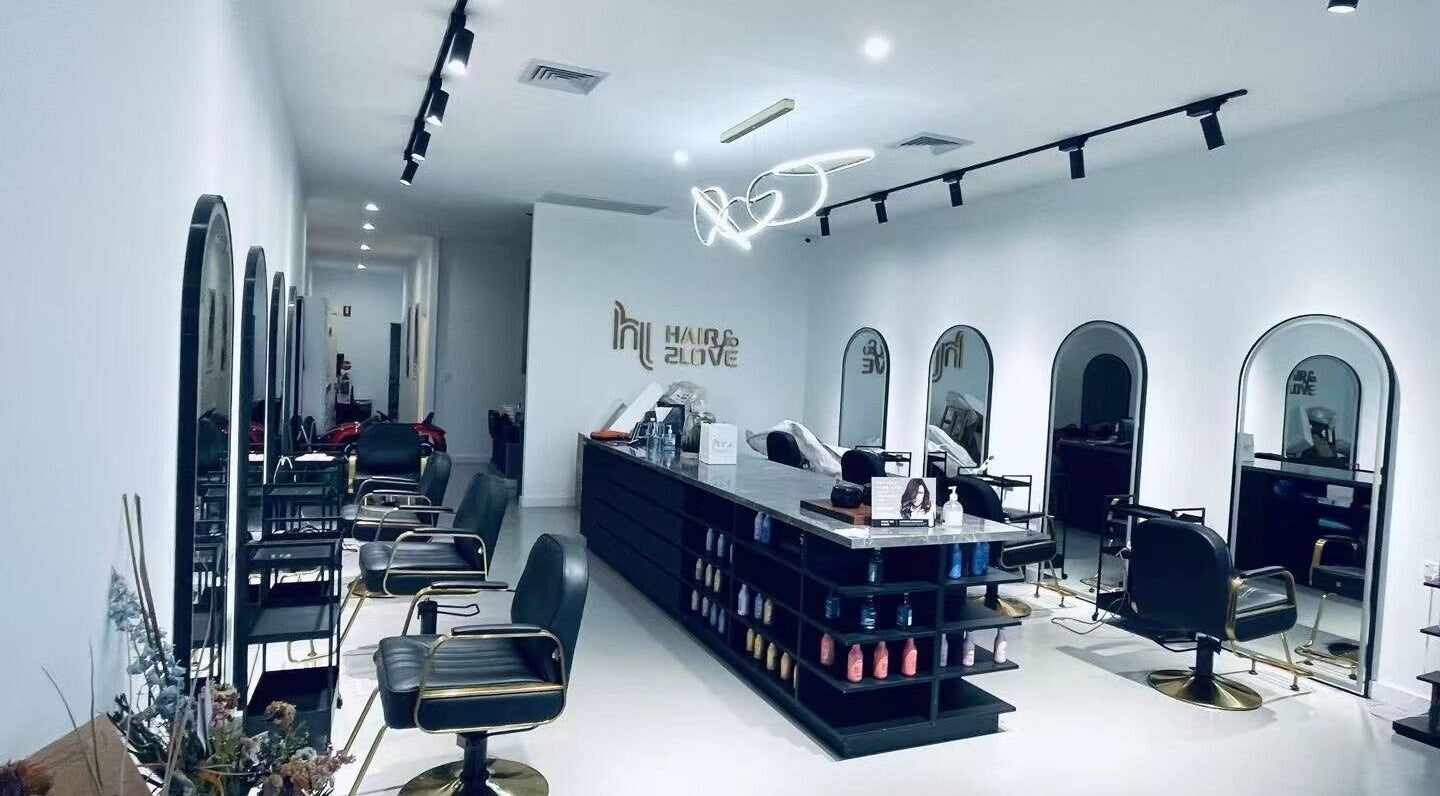 Modern salon interior of Hair 2 Love in Melbourne, Victoria, AU with stylish chairs and mirrors.