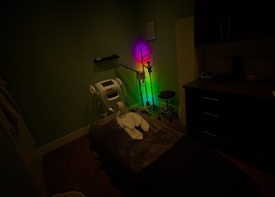 Tranquil treatment room at Glow & Grace Esthetics, Calgary, Alberta, CA, featuring soft lighting and a cozy ambiance.