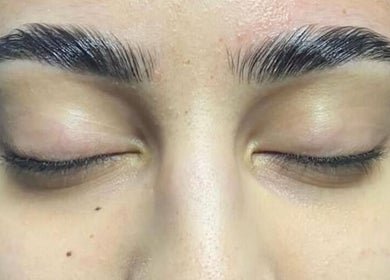 Closeup of expertly groomed eyebrows at Glow & Grace Esthetics, Calgary, Alberta, CA.