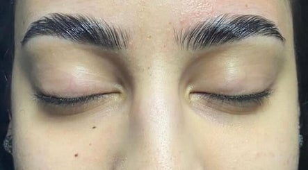 Closeup of expertly groomed eyebrows at Glow & Grace Esthetics, Calgary, Alberta, CA.