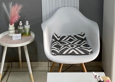 Cozy nail lounge at Nailcraftsbynene, Pretoria, Gauteng, ZA with modern chair and stylish decor.
