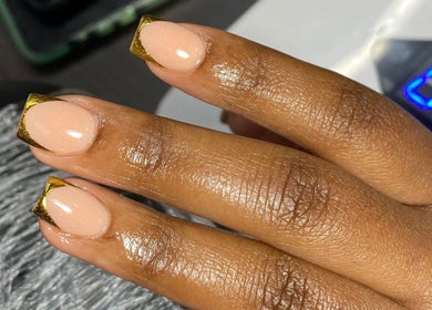 Elegant gold-tipped nails by Nailcraftsbynene at Pretoria, Gauteng, ZA. Perfect for a chic and modern look.