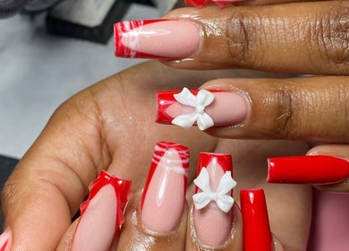 Stylish red and pink nails with bows at Nailcraftsbynene, Pretoria, Gauteng, ZA.