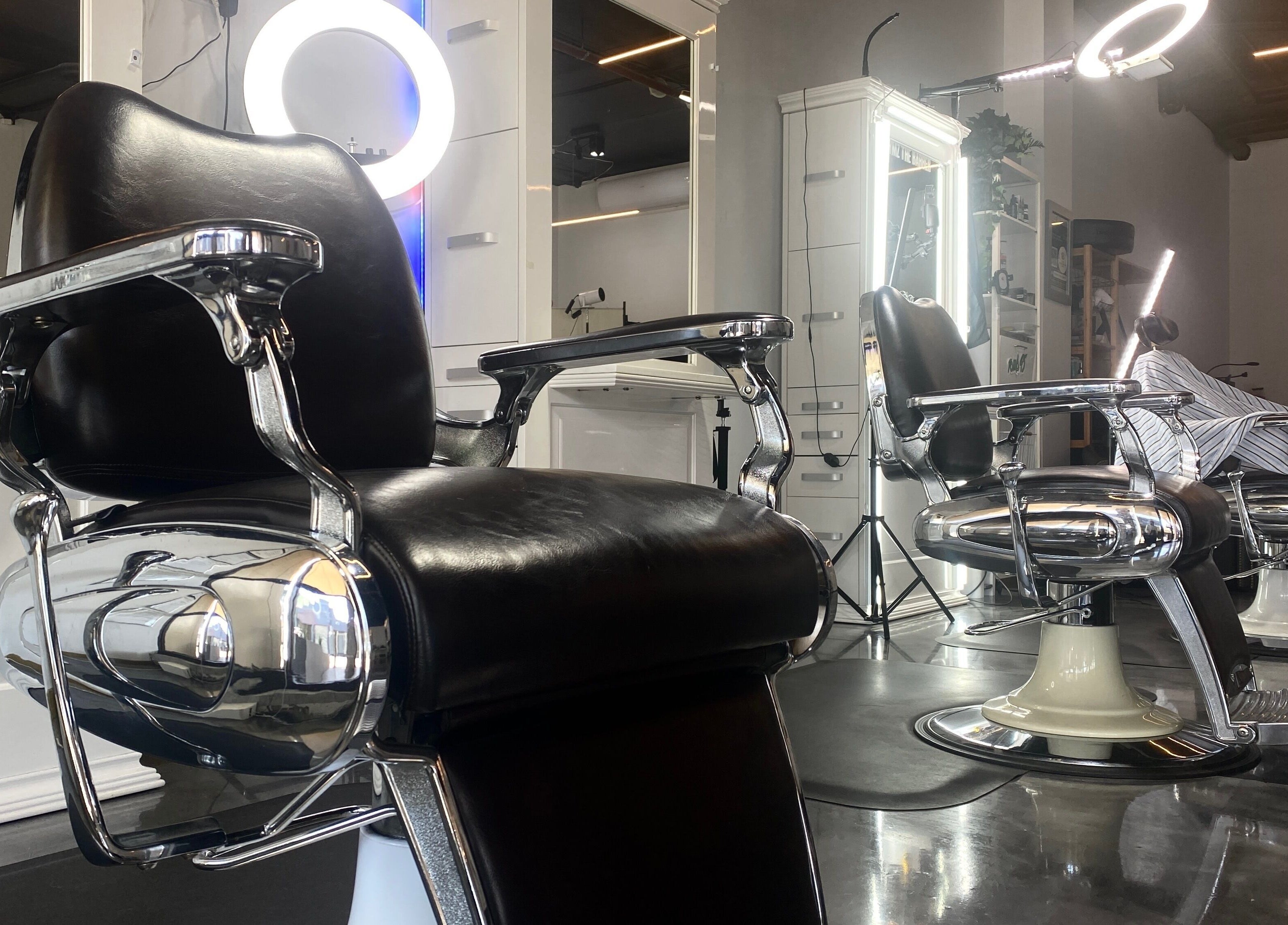 Stylish salon chairs at Silk Barbershop Carnegie, Melbourne, Victoria, AU, creating a chic and modern vibe.