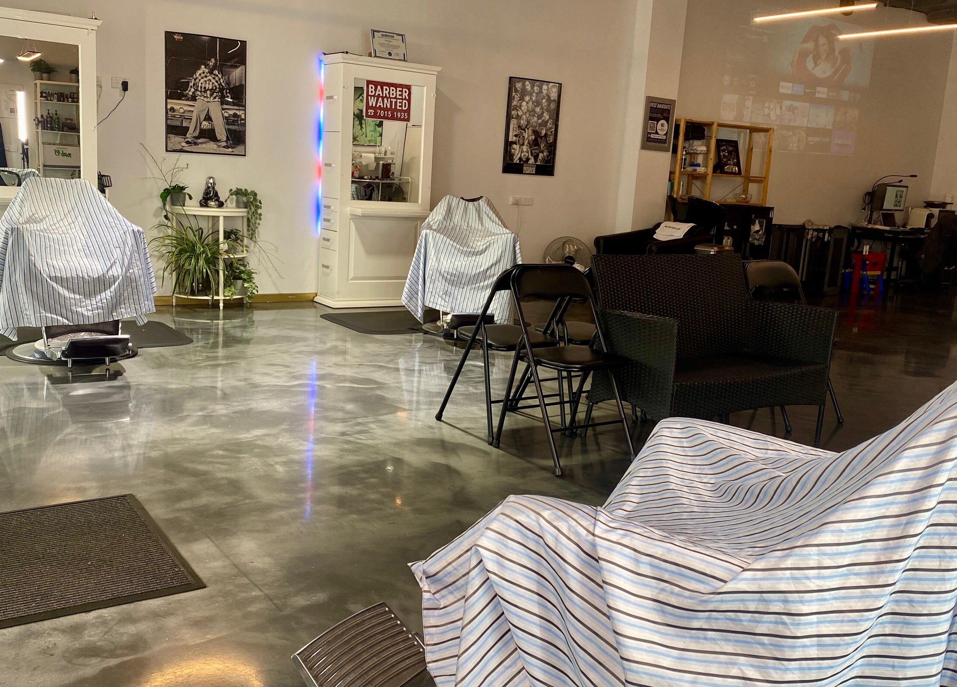 Spacious interior of Silk Barbershop Carnegie, Melbourne, Victoria, AU with sleek chairs and modern decor.