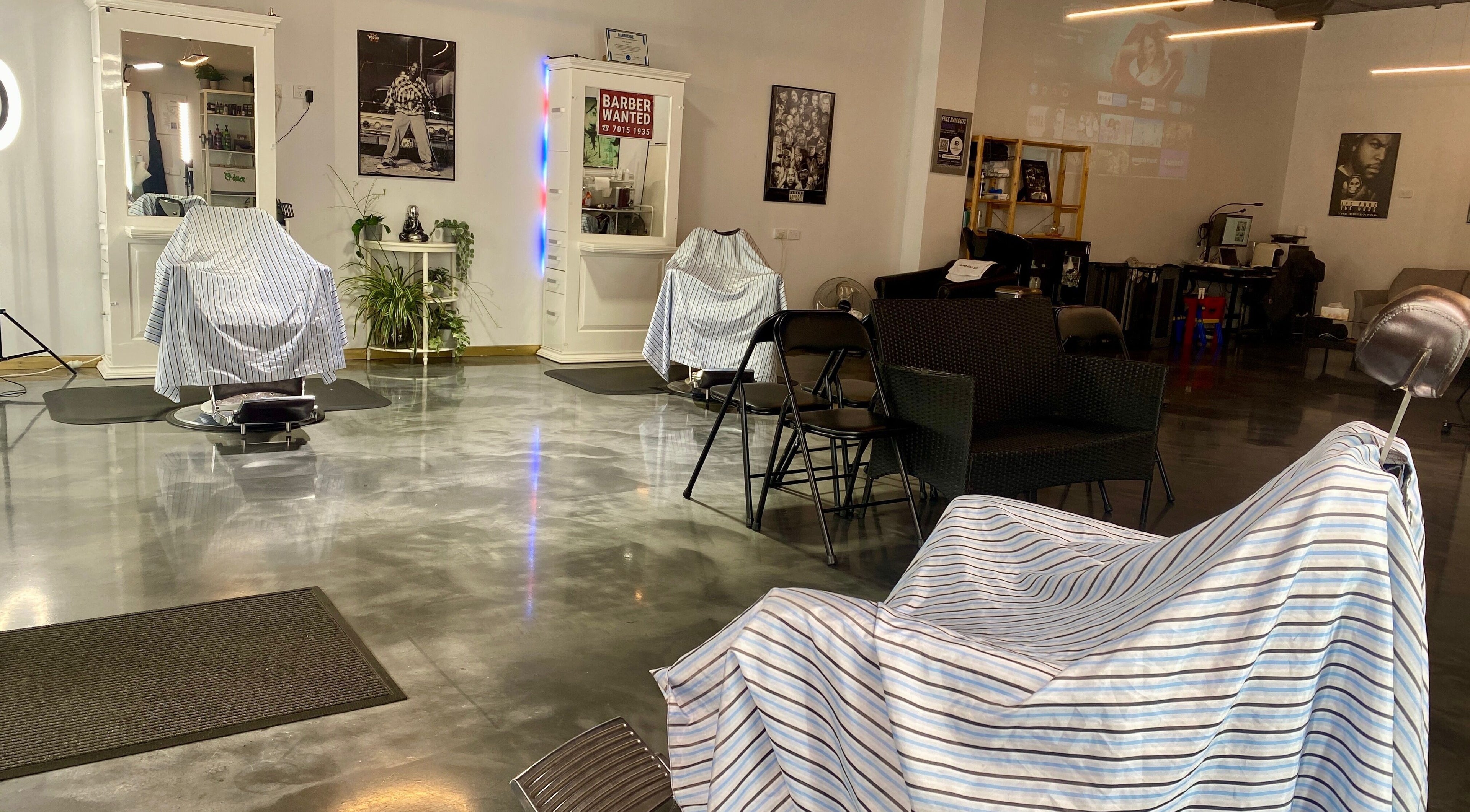 Spacious interior of Silk Barbershop Carnegie, Melbourne, Victoria, AU with sleek chairs and modern decor.
