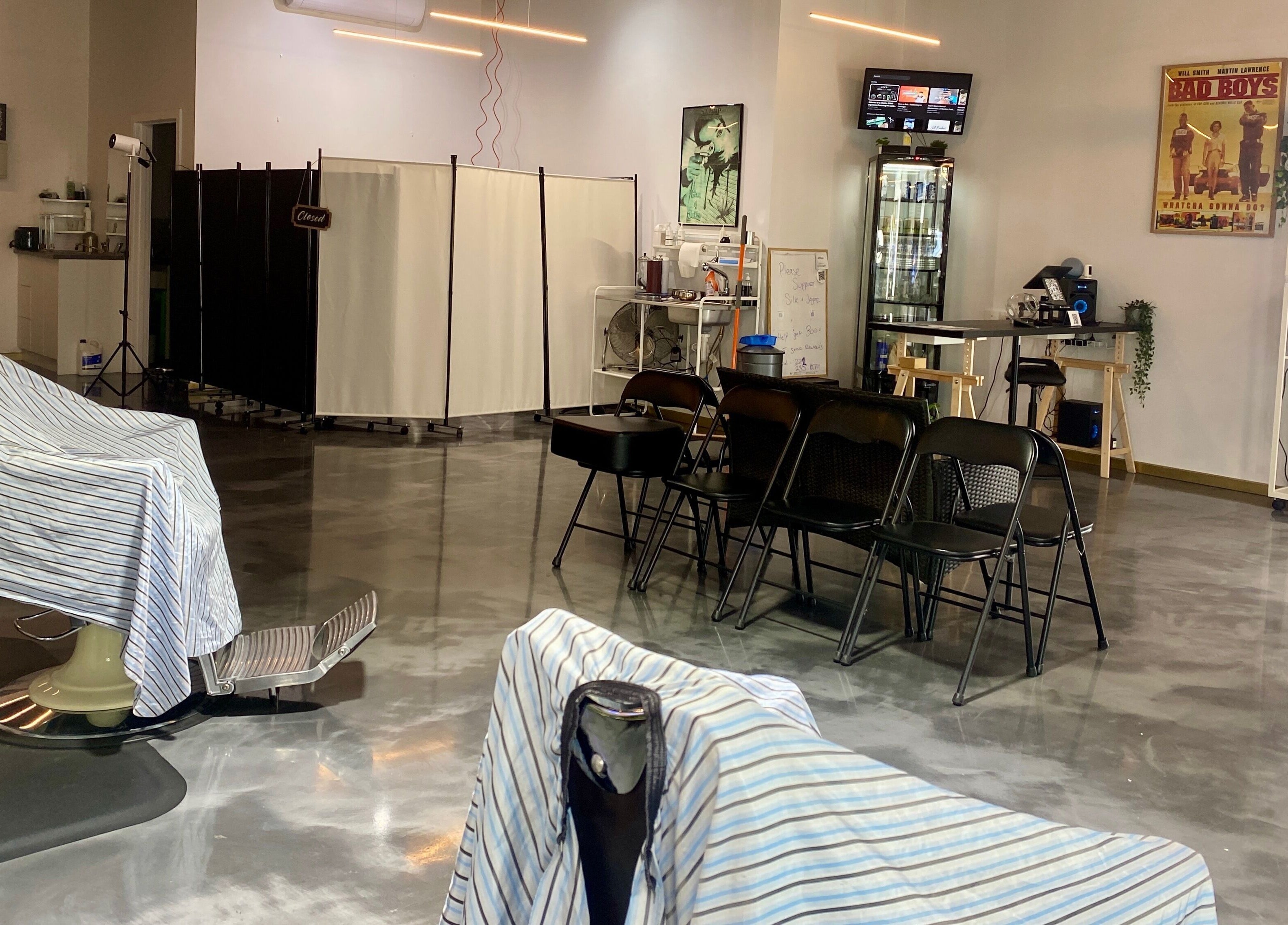 Chic interior of Silk Barbershop Carnegie in Melbourne, Victoria, AU with stylish chairs and modern décor.