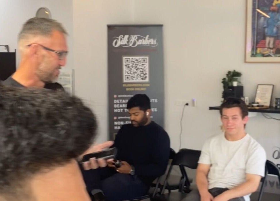 Relaxed atmosphere at Silk Barbershop Carnegie, Melbourne, Victoria, AU, featuring seating and decor.