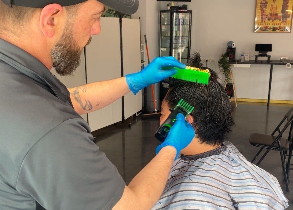 Professional barber styling hair at Silk Barbershop Carnegie, Melbourne, Victoria, AU.