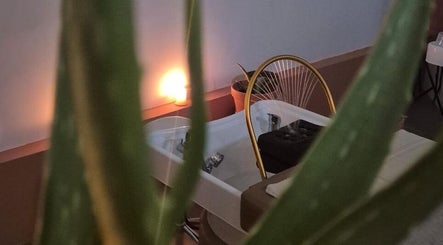 Tranquil spa setting at Maison Juline in Il-GZIRA, MT with a cozy chair and ambient lighting.