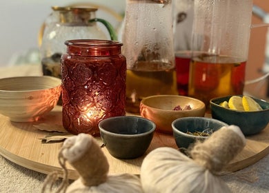 Cozy tea setup in warm ambiance at Maison Juline, Il-GZIRA, MT offering relaxation and wellness.