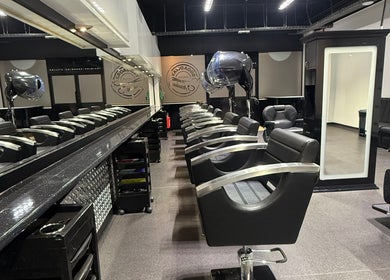 Modern salon chairs and mirrors at The Broadway Hair Salon, Worthing, England, GB enhancing style and comfort.