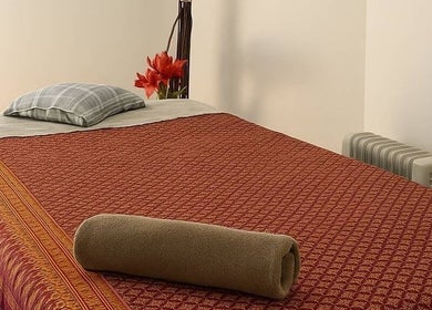 Cozy massage table at Ba Yha Thai Massage, Melbourne, Victoria, AU, offering relaxation and comfort.