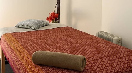 Cozy massage table at Ba Yha Thai Massage, Melbourne, Victoria, AU, offering relaxation and comfort.