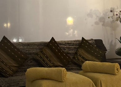 Cozy seating area with cushions and flowers at Ba Yha Thai Massage, Melbourne, Victoria, AU.
