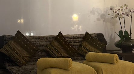Cozy seating area with cushions and flowers at Ba Yha Thai Massage, Melbourne, Victoria, AU.