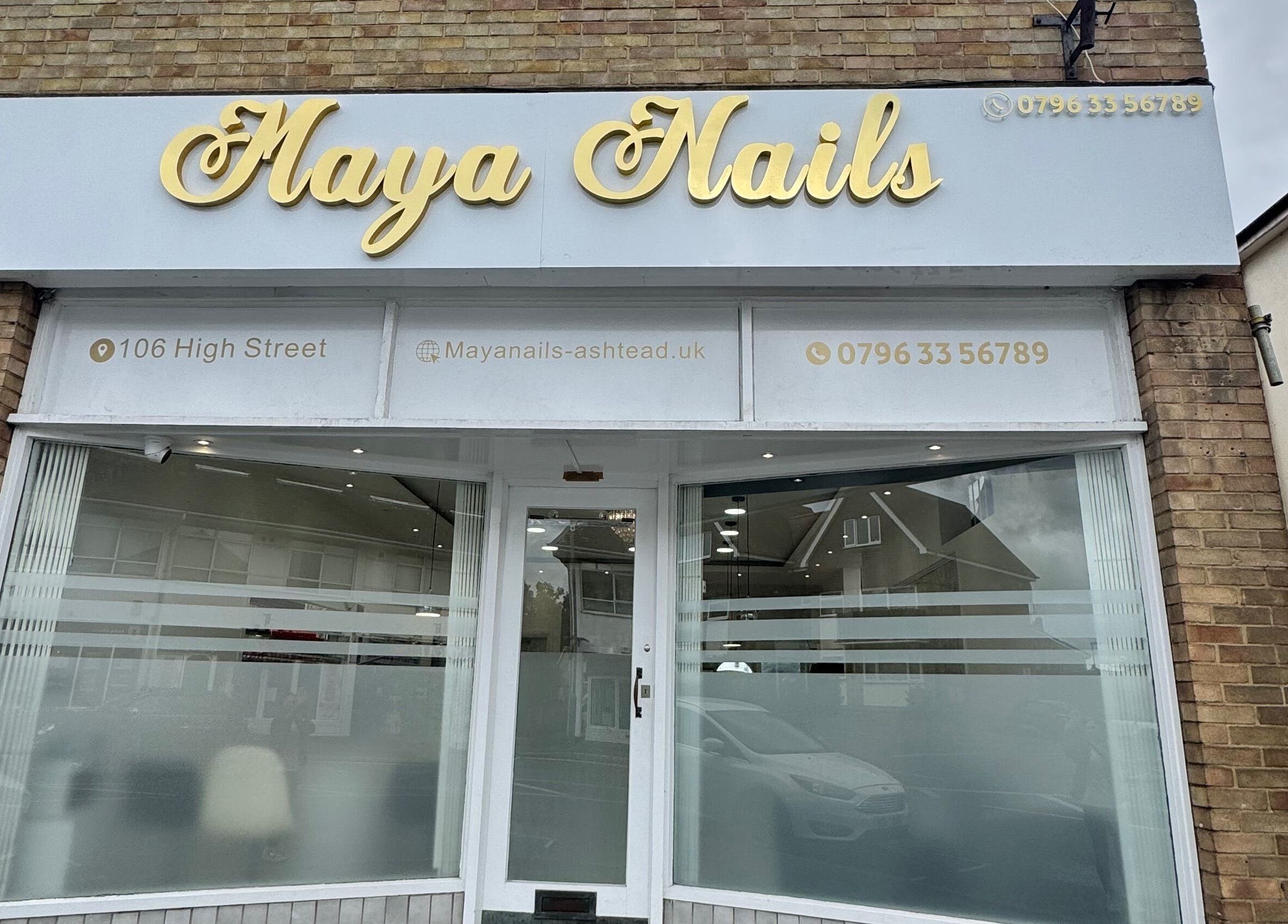 Front view of Maya Nails, a beauty salon located at Ashtead, England, GB featuring stylized signage.
