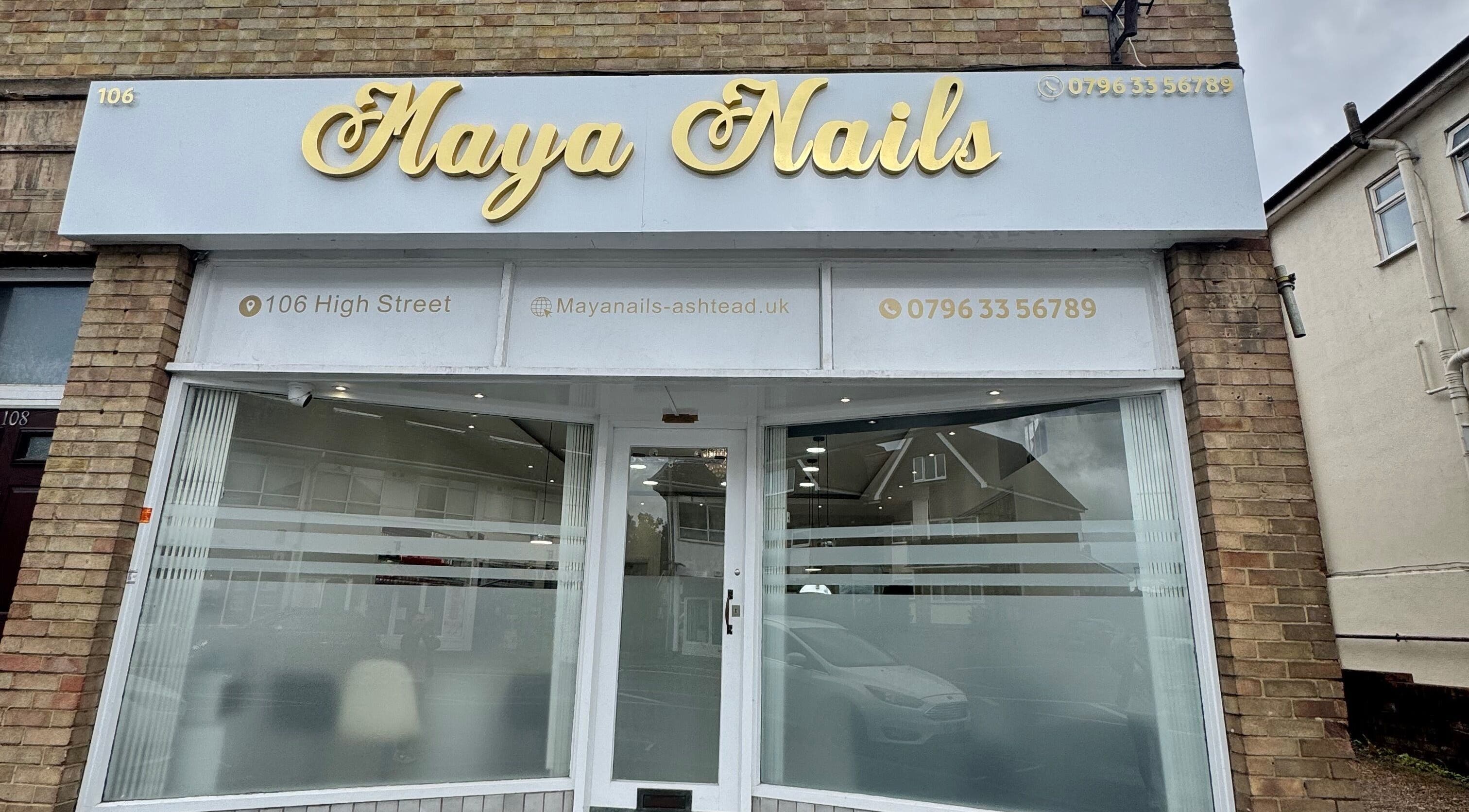 Front view of Maya Nails, a beauty salon located at Ashtead, England, GB featuring stylized signage.
