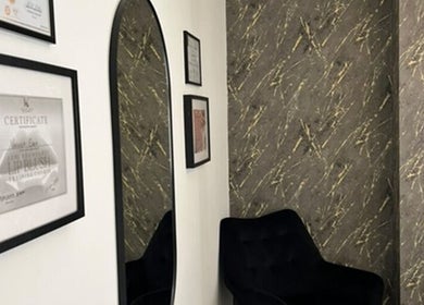A stylish corner with certificates and mirror at Vasilica Manchester Aesthetics in Dukinfield, England, GB.